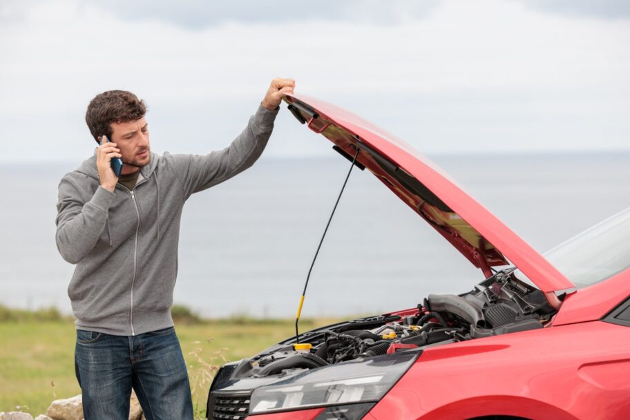 Displeased,Man,Breaks,Down,Car,In,The,Middle,Of,Trip